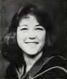 Black and white portrait of a smiling woman named Terri Bramer (Reade).