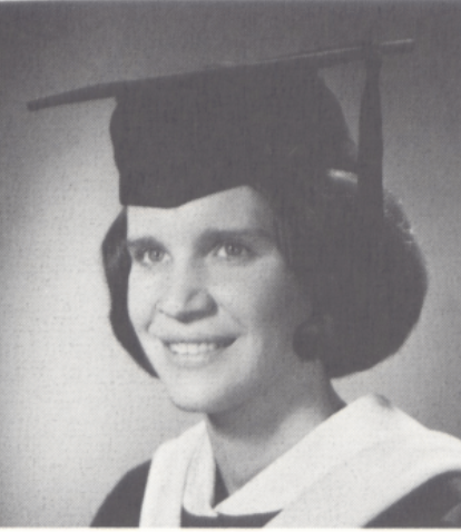 Black and white photo of a person in a graduation cap and gown.