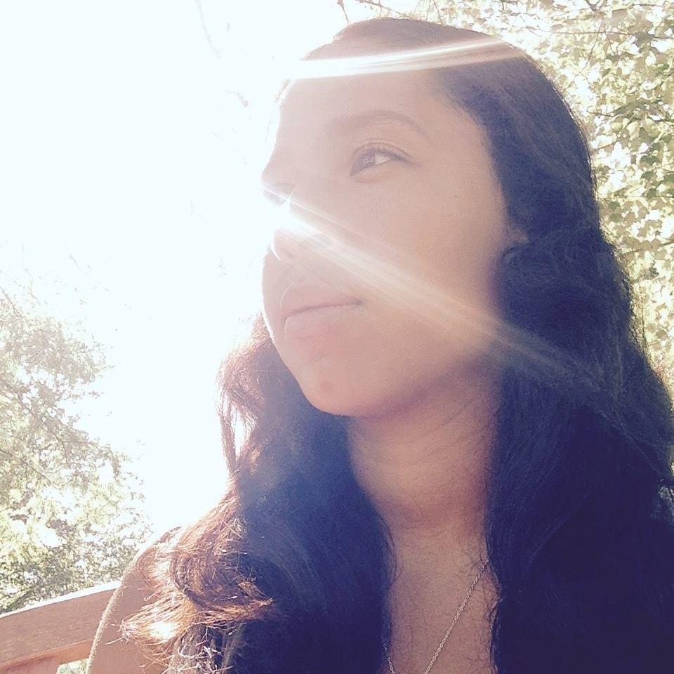 A person in sunlight with trees in the background. image link to story