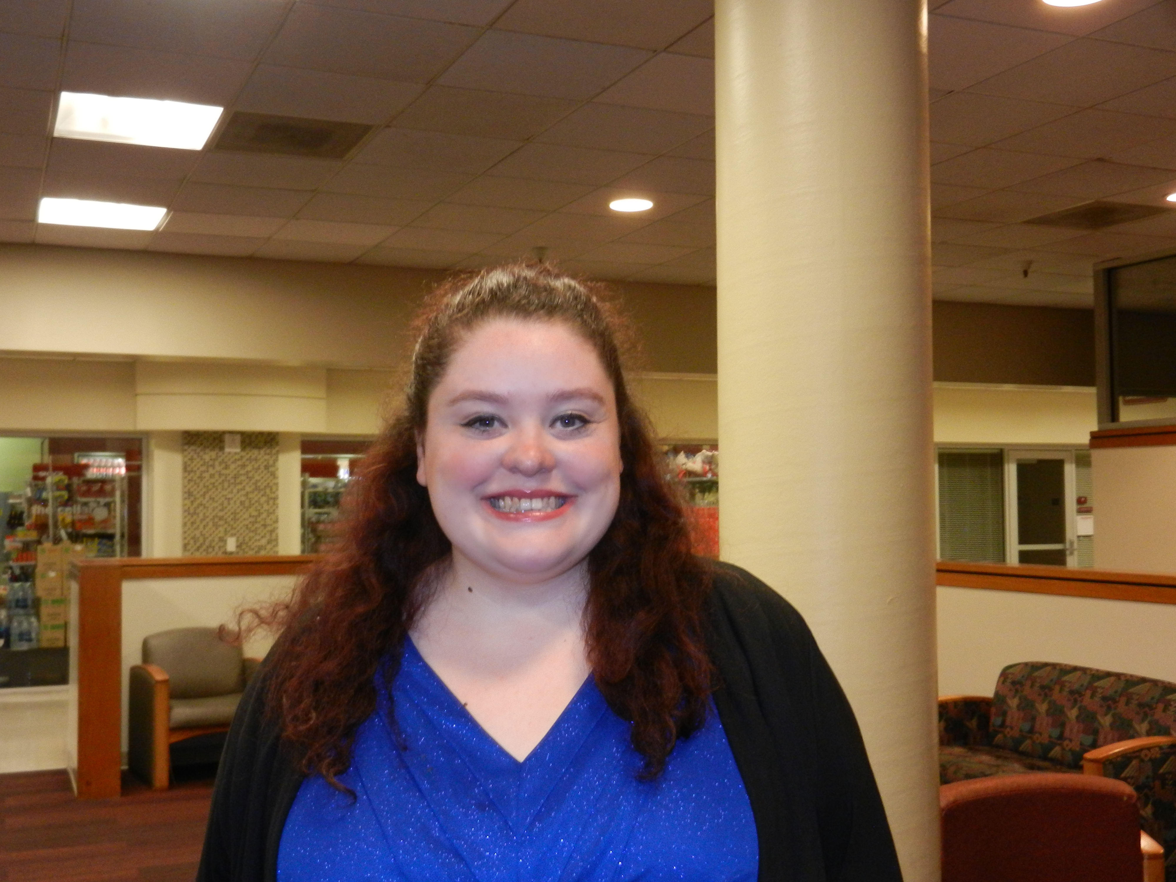 A person smiling in an indoor setting. image link to story