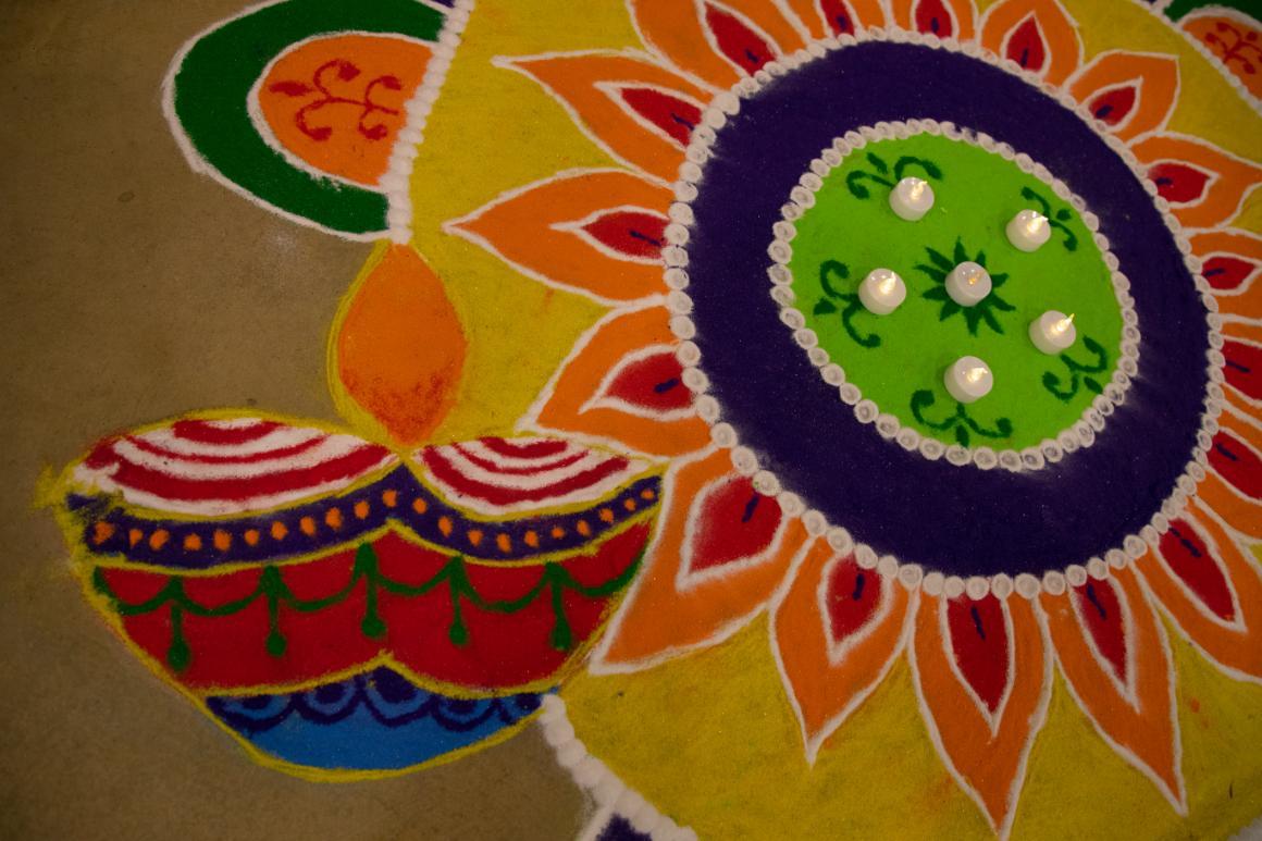 Students created intricate drawings made of colored sand called Rangoli for the Hindu Diwali festival