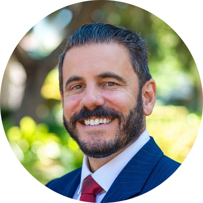 Dylan Houle headshot with unfocused background