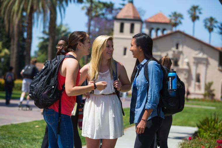 Group of girls standing at fountain 