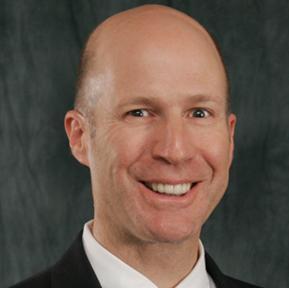 A man wearing a suit and tie