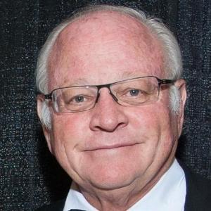 A man wearing a bow tie and glasses.