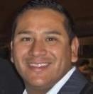 A smiling person in a suit.