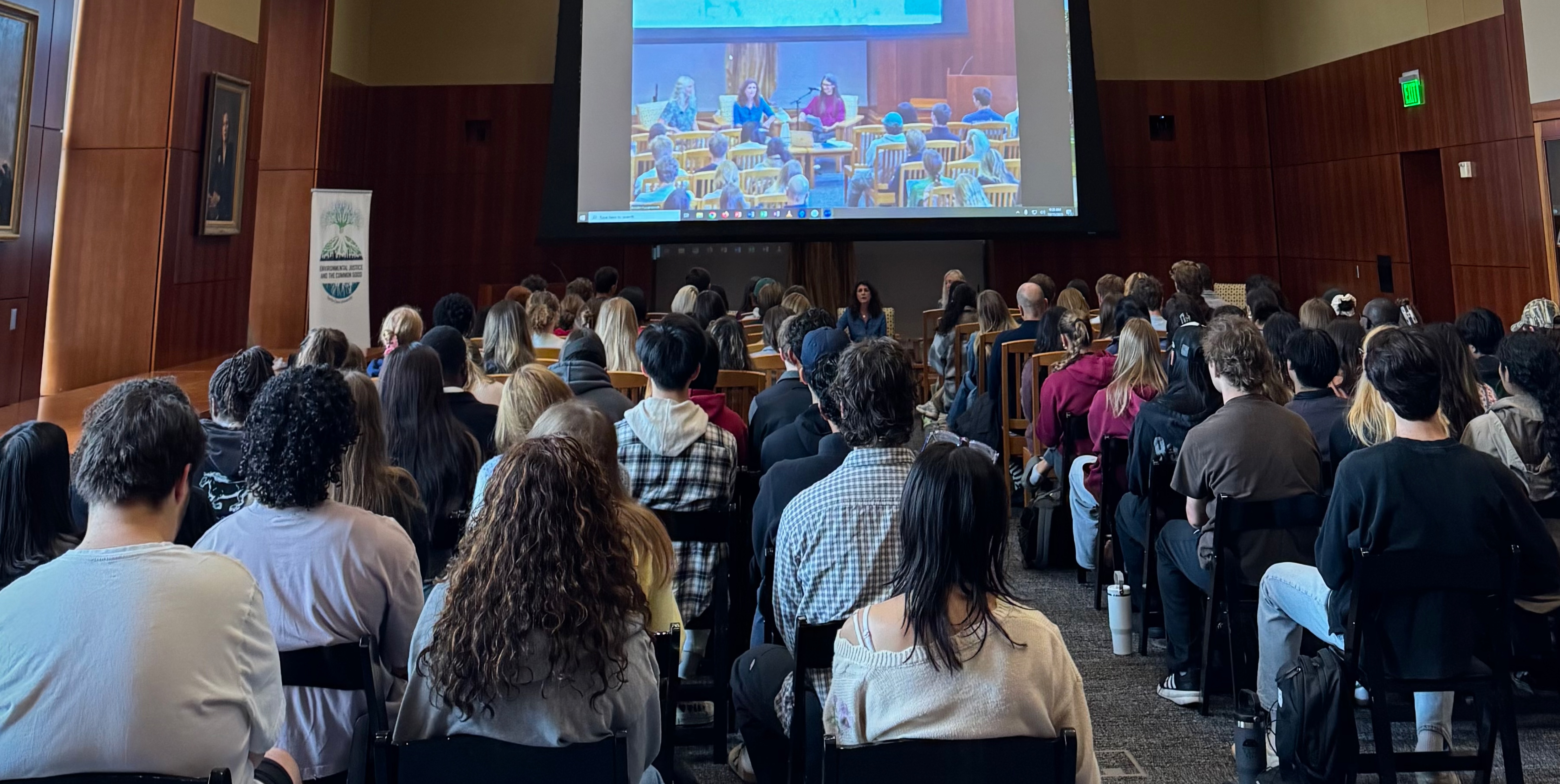 an audience listening to panelists