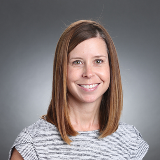 Woman with shoulder-length brown hair.