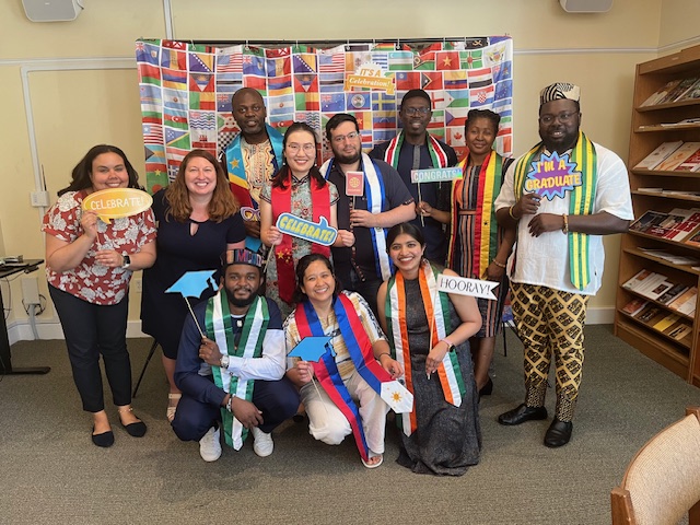 JST graduating students and Global Engagement staff in international graduation stoles