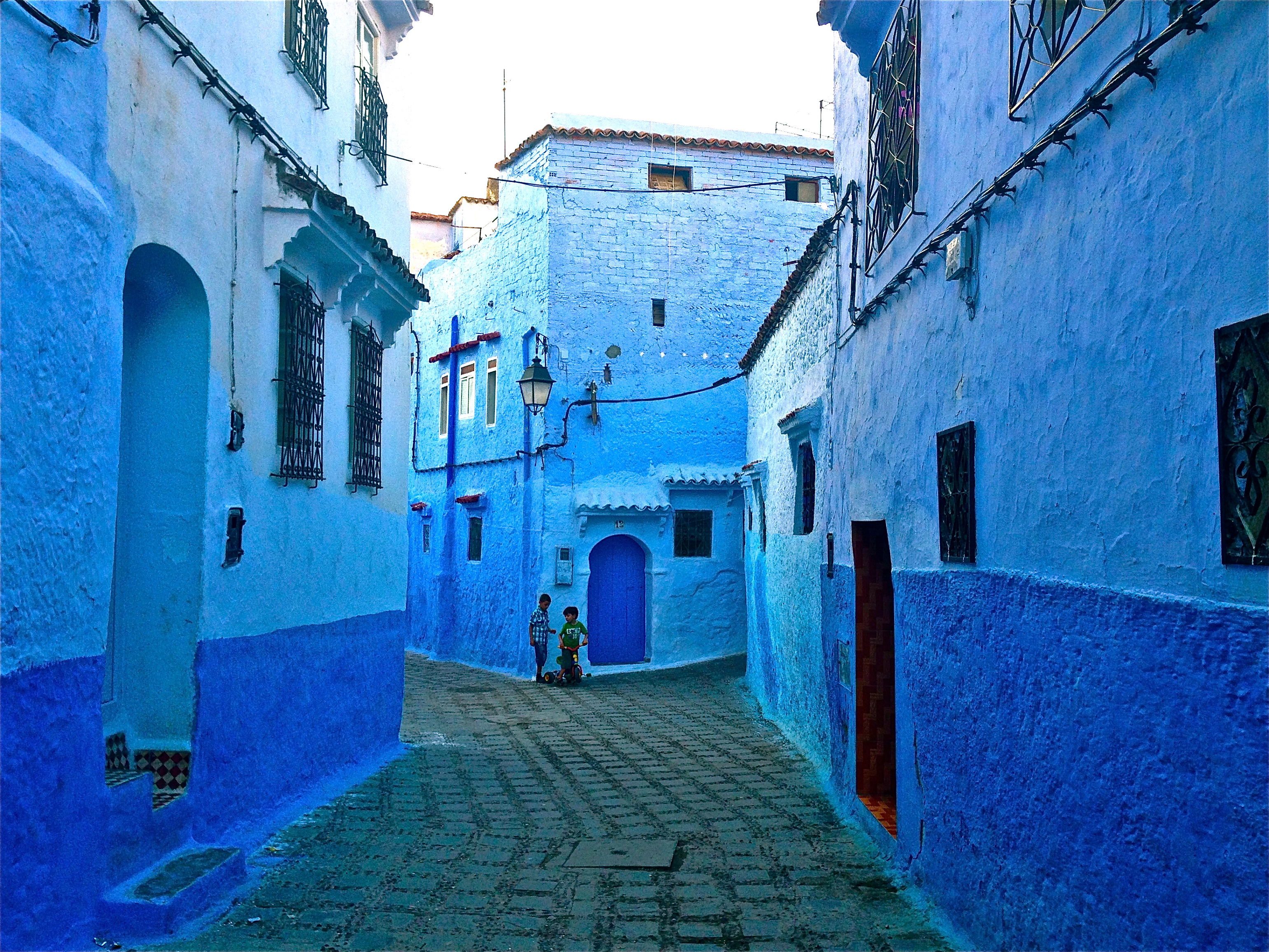 Decorative image of a completely blue street in Morocco 