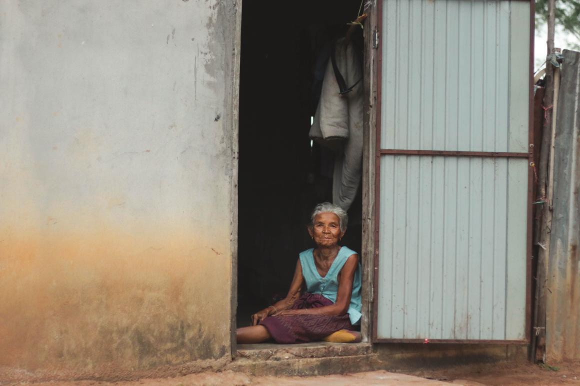 Photo of woman sitting in her home