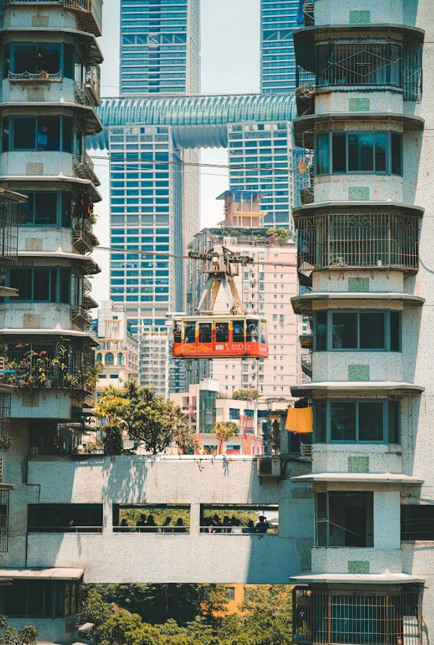 Chongqing, China; Skyscrapers with red trolley between them