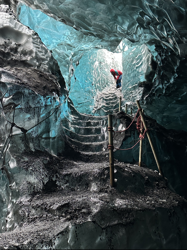 Cave in Iceland with sparkling blue glacier coated with volcanic ash - Cave in Iceland with sparkling blue glacier coated with volcanic ash Link to file