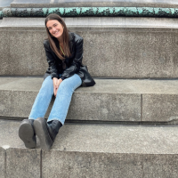 Elizabeth Biely sitting on concrete stairs