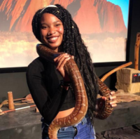 Alisha Burch holding a large snake