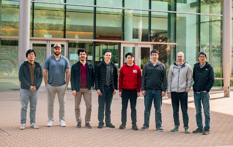 Decorative; group posing in front of SCDI