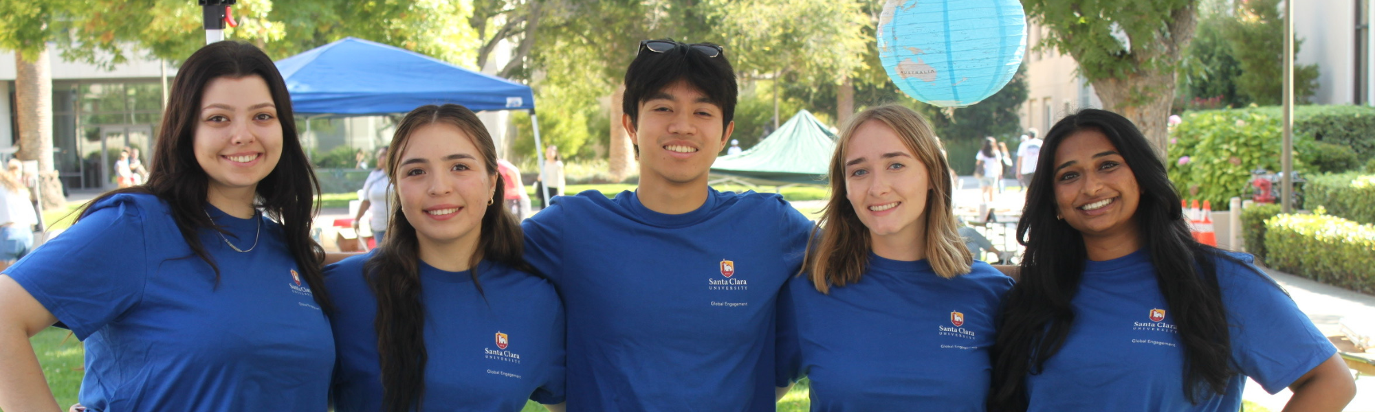 Decorative; five Study Abroad Peer Advisors smiling at an event