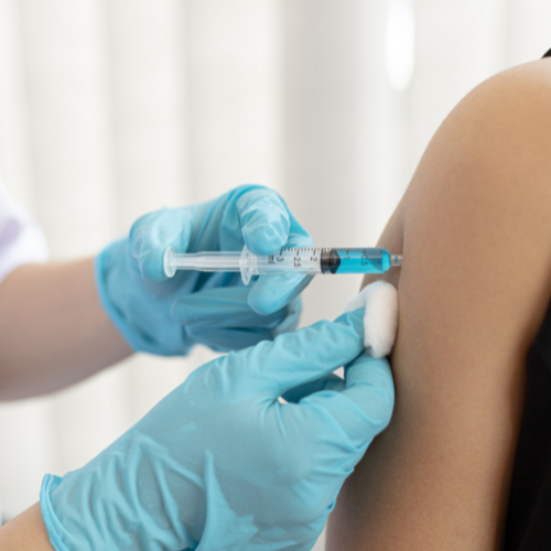 Nurse giving a vaccine shot 