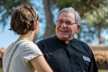 Fr. Scholla with student 