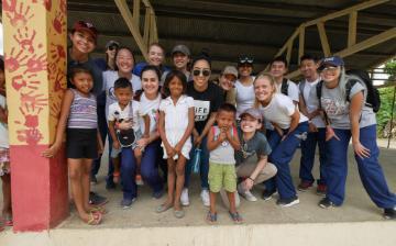 A group of people posing under a shelter in Panama.
