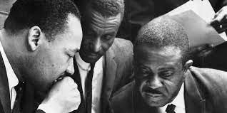 A black and white photo w/ Clarence Jones and MLK, Jr.