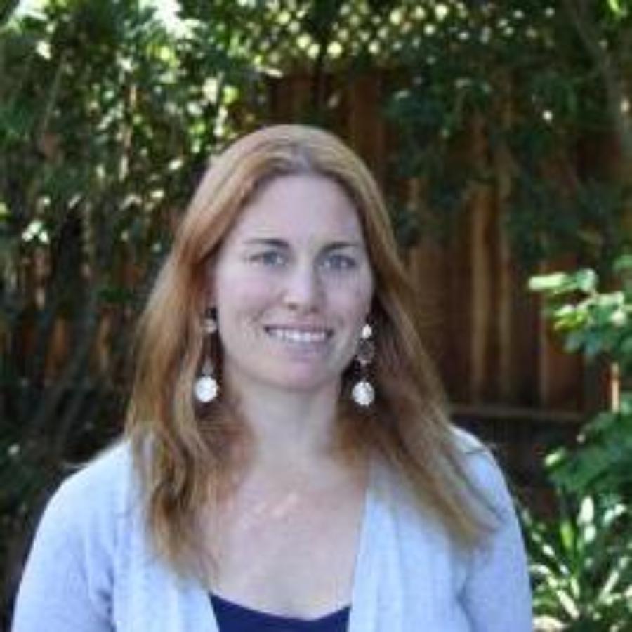 woman outdoors smiling at camera 