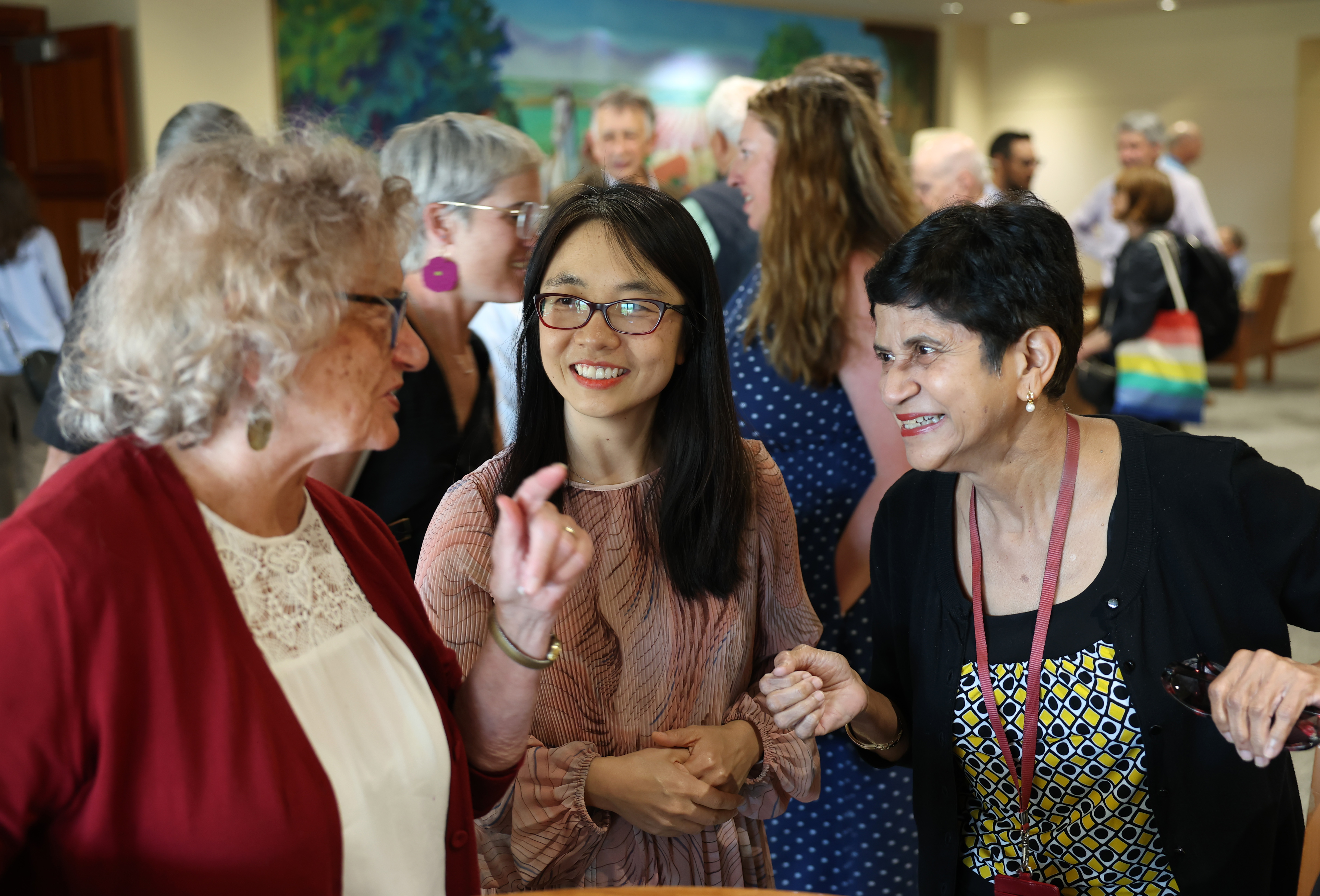 3 faculty laugh together