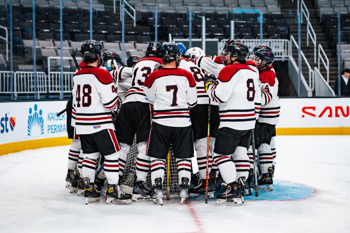 Team huddles before SAP Center game
