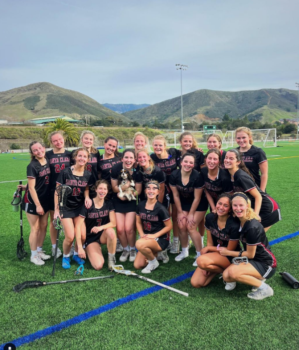 All of the Women's Lacrosse team smiles after a game in cal poly.