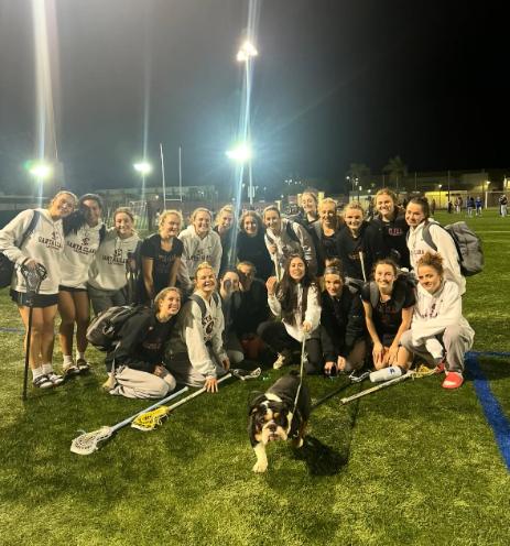 2025 Women's Club Lacrosse Team evening under lights