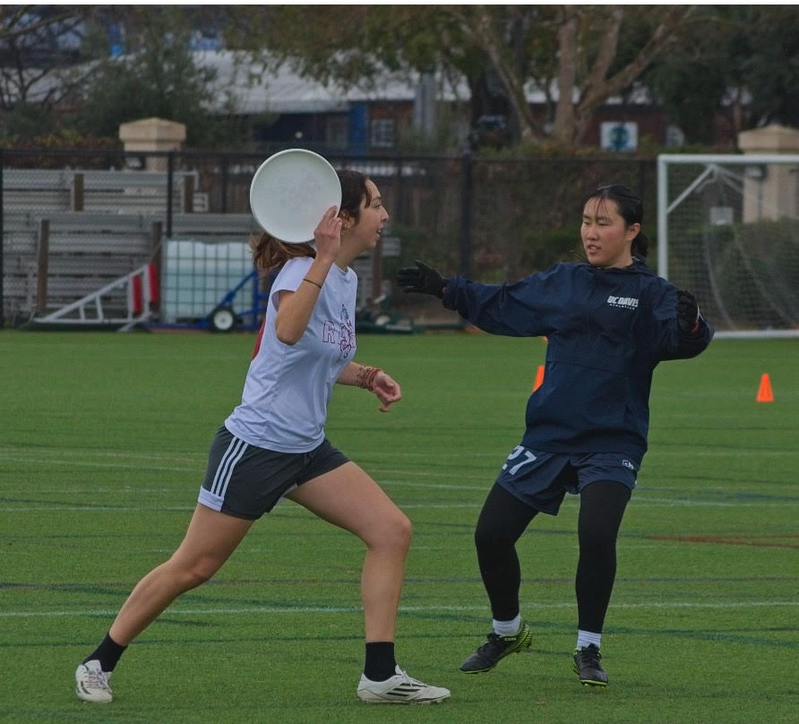Student playing frisbee