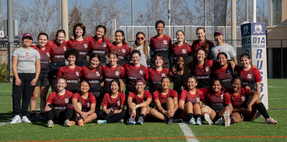 women's rugby team in front of uprights on Bellomy Field