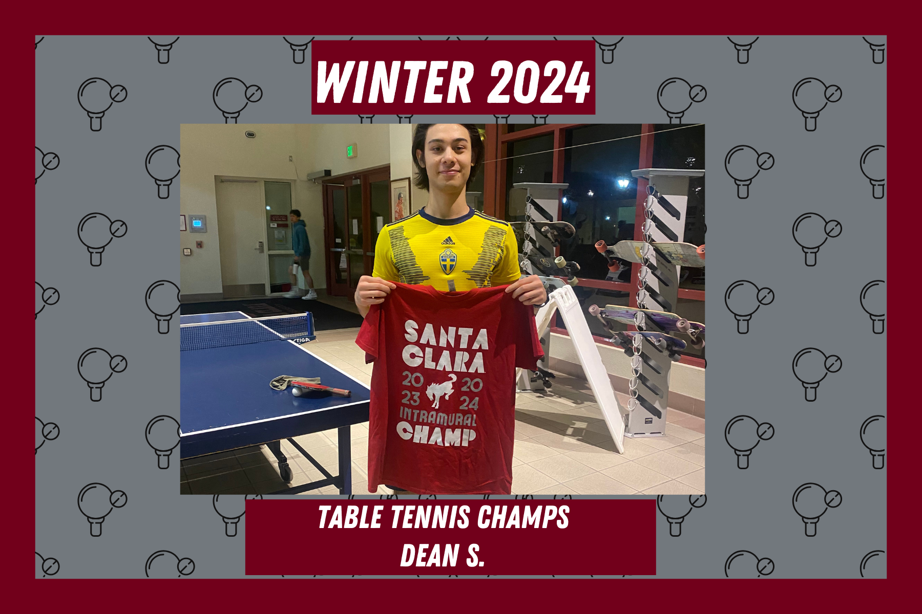 Photo of Table Tennis league champion, Dean S., posing with his intramural champion t shirt in the Malley Center lobby.