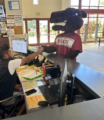 Bucky the Bronco SCU mascot checking into to use the Malley Center