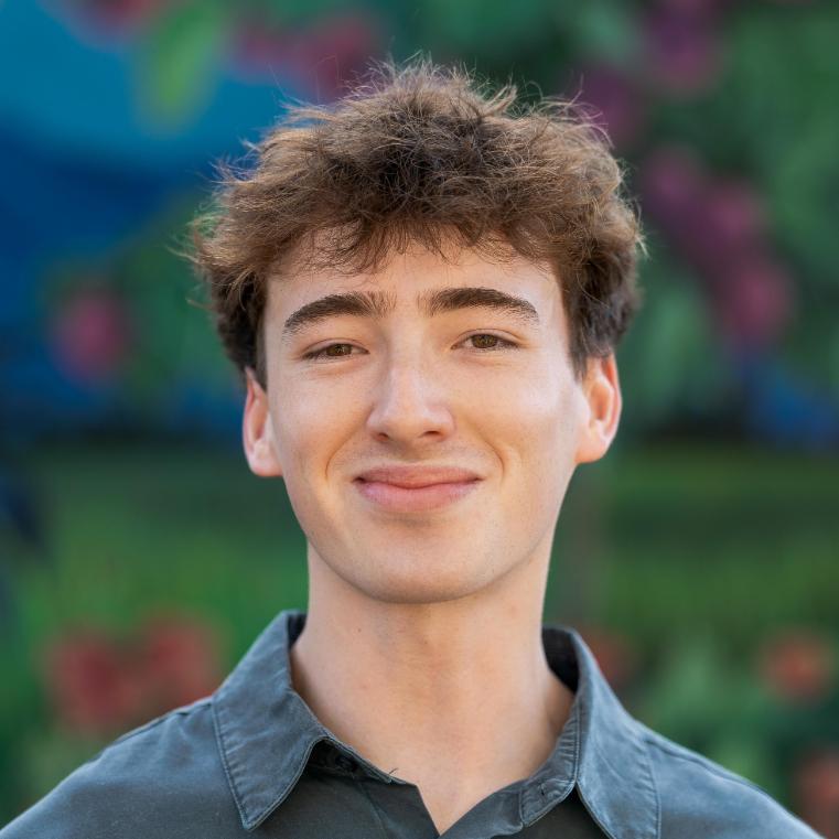 A photo of Drew smiling 