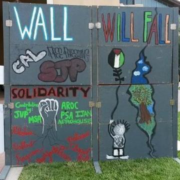 An art piece of different images on a gray wall in support of human rights. Links to Human Rights in a Global World Pathway page.