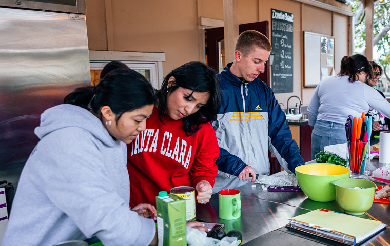 Students preparing a Nourish Nights Meal in the Forge Garden Outdoor Kitchen 
