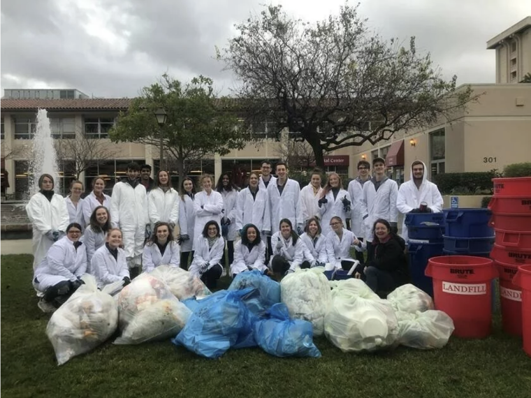 Professor Stephanie Hughes and students categorizing various types of waste in January 2020.