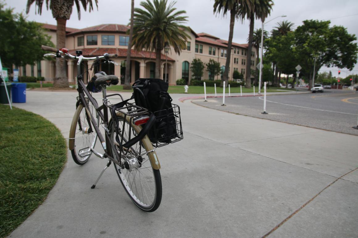 A bicycle is parked near Graham Residence Hall on SCU's campus