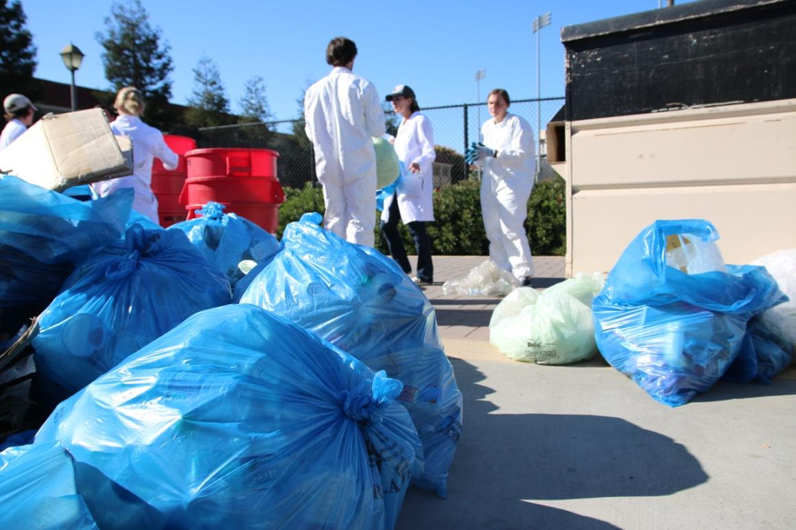 A recycling bag and students at a waste diversion