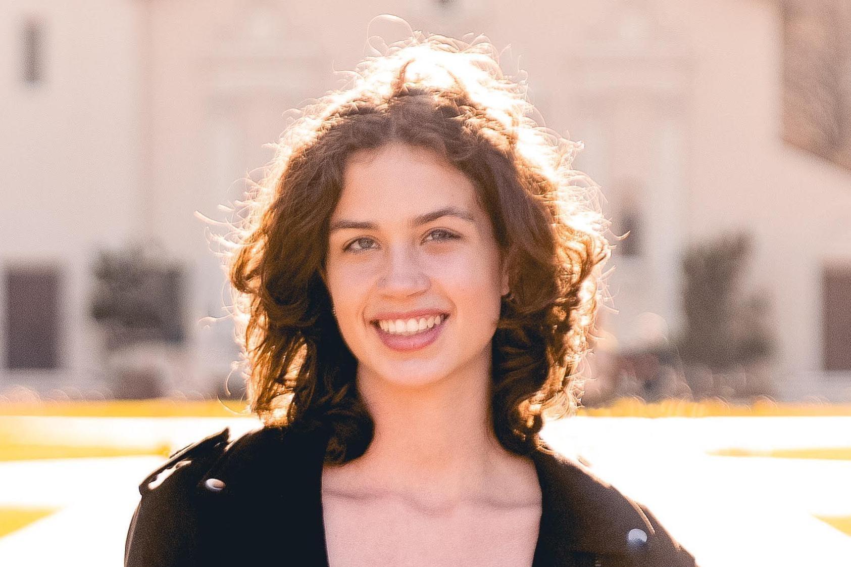 A photo of Sally smiling. 