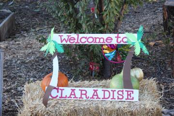 Photo booth props arranged on a bale of hay.