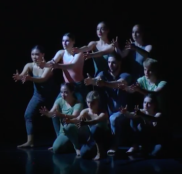 A group of dancers in coordinated poses, titled Zona reach.