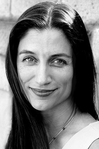 A headshot of Kristin Kusanovich in black and white