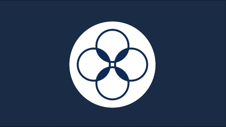 The logo for Climate One, four white circles outlined in dark blue forming a flower