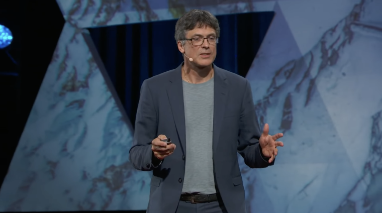 Psychologist and economist Per Espen Stokes speaks on stage at the TED Conference