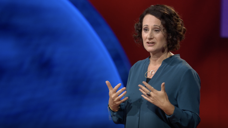 Psychologist Renée Lertzman speaks on stage at the TED Women conference