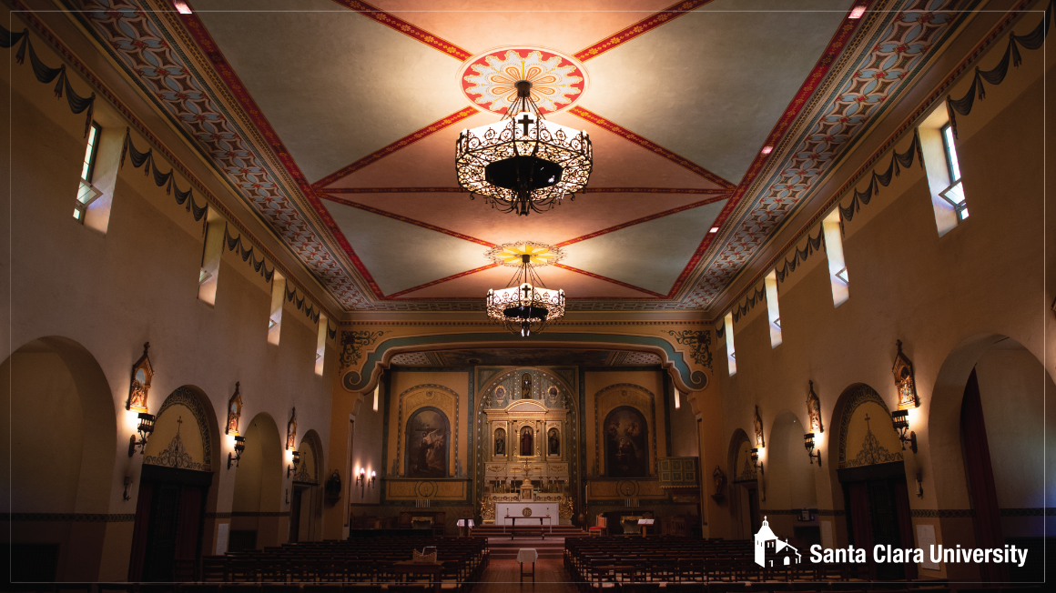Pulled back image of Mission interior, includes seating and altar