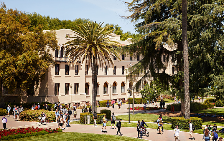 SCU students walk and ride across campus.