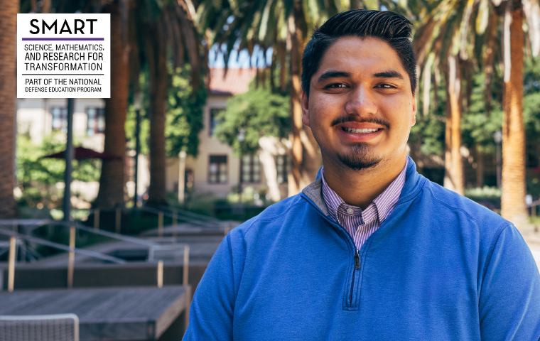 Julian Clark '27 poses in the SCDI courtyard at Santa Clara University